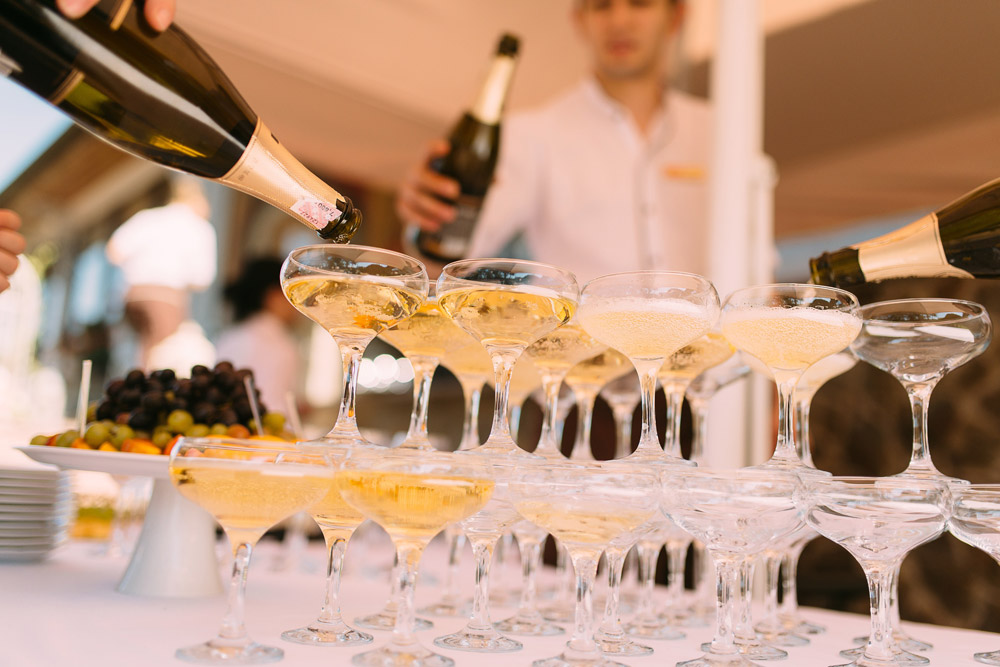 stacked champagne glasses at wedding reception