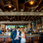 bride and groom kissing at Deck655